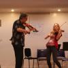 Mark and Maggie began the "Playdown" with "Fiddlin' Around" from upcoming Book V. Students join in as the tunes progress through the books all the way to Book I with everyone on stage! Photo by Richard Casamento. 