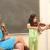Playing violin in the classroom. Photo by Richard Casamento. 